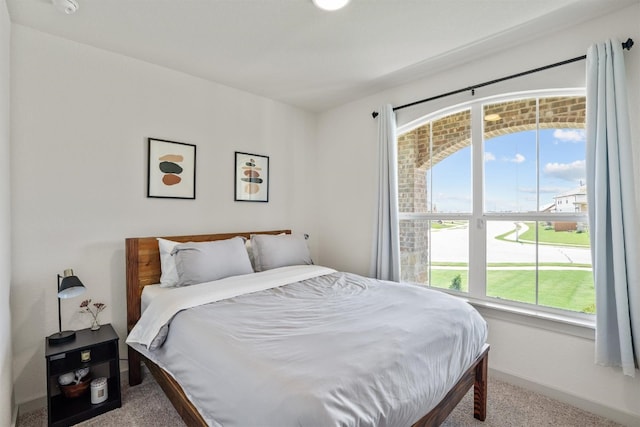 bedroom featuring carpet