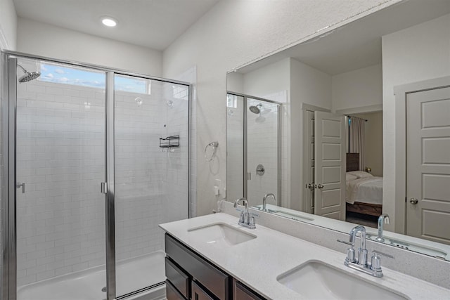 bathroom with vanity and a shower with shower door