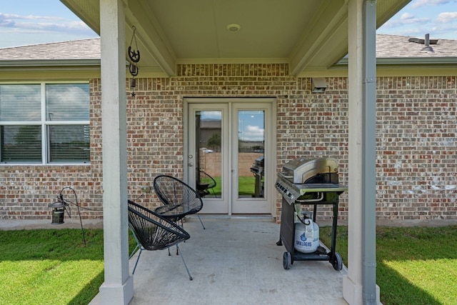 view of patio featuring french doors and a grill