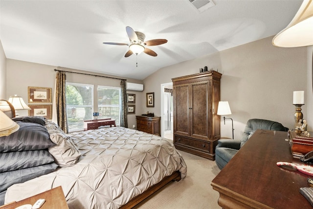 bedroom with vaulted ceiling, ceiling fan, light carpet, and a wall mounted air conditioner