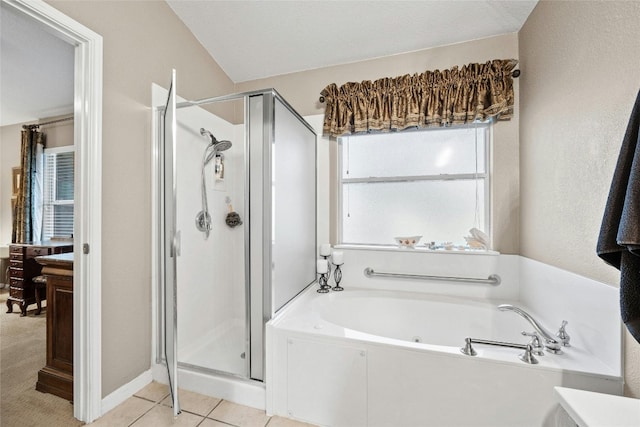 bathroom featuring tile patterned flooring, a textured ceiling, and plus walk in shower