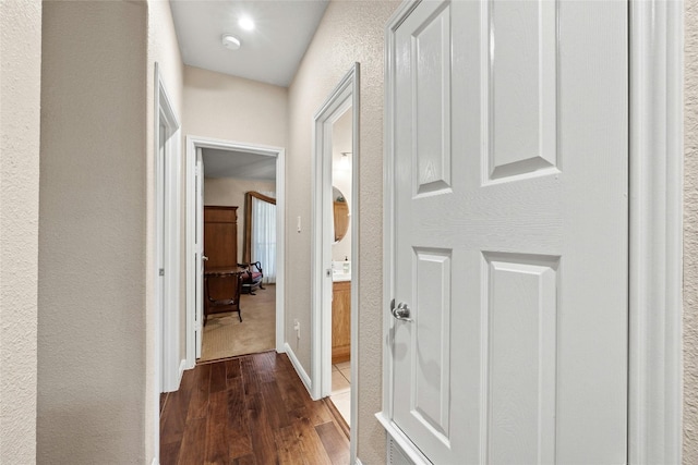 hall with dark hardwood / wood-style floors