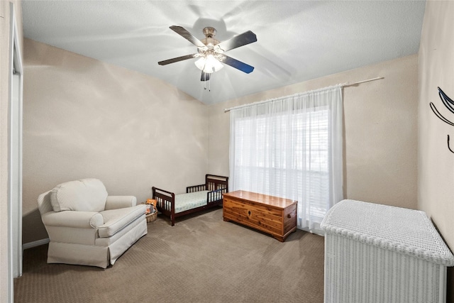 living area with ceiling fan and light colored carpet