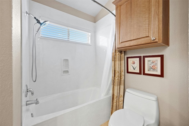 bathroom with shower / bathtub combination with curtain and toilet