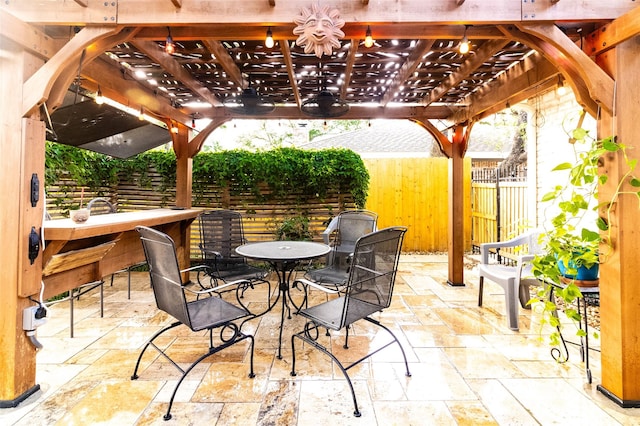 view of patio with a pergola and an outdoor bar