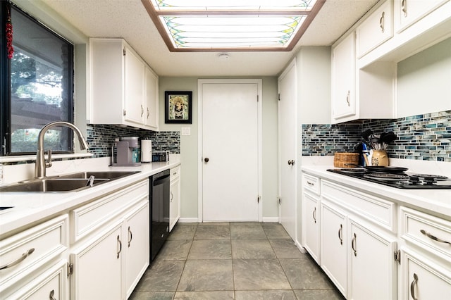 kitchen featuring decorative backsplash, sink, white cabinets, and black appliances