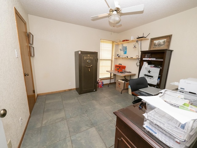 office featuring ceiling fan and a textured ceiling