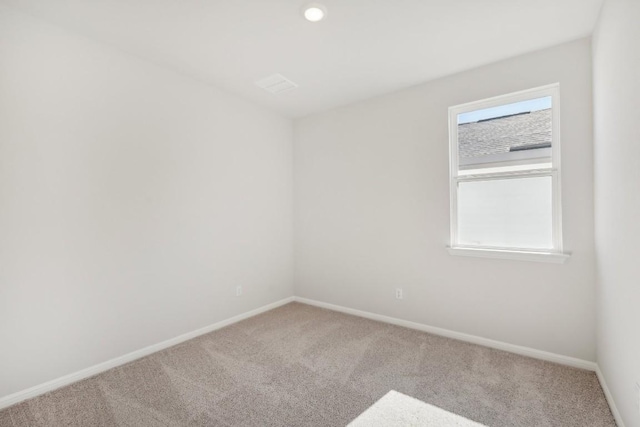 unfurnished room with carpet flooring