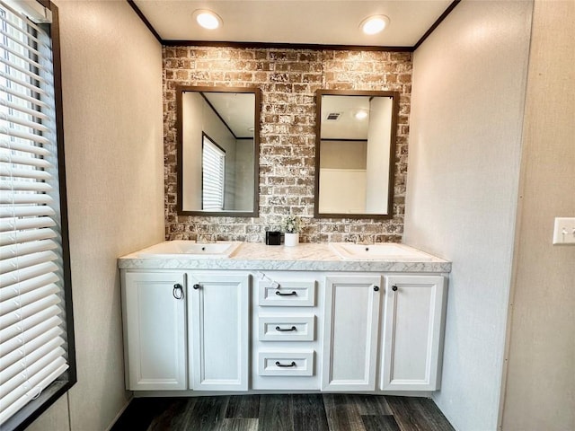 bathroom with hardwood / wood-style flooring and vanity