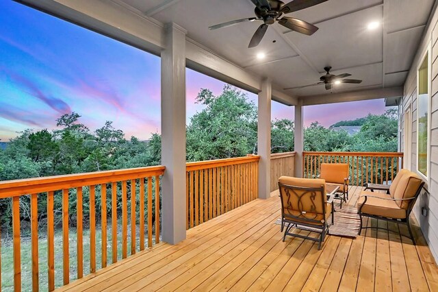 deck at dusk with ceiling fan