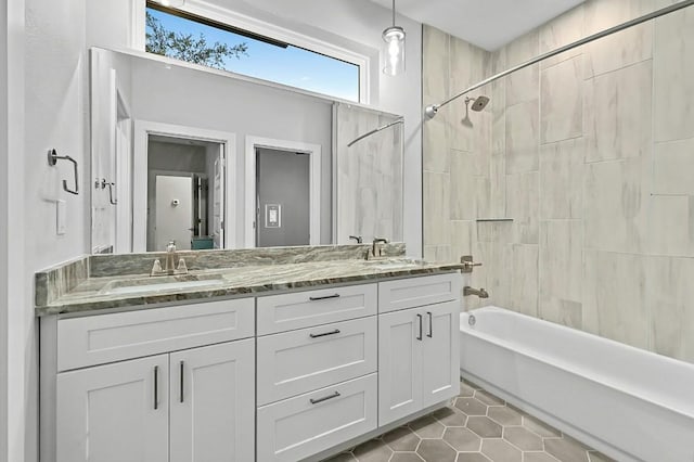 21201 Norris Cv, Lago Vista, TX 78645 - full bath featuring tile patterned flooring, double vanity, and shower / bathtub combination