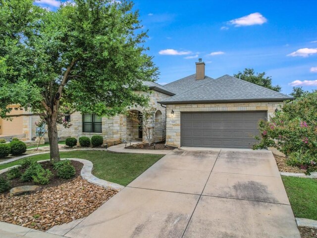 ranch-style house featuring a garage