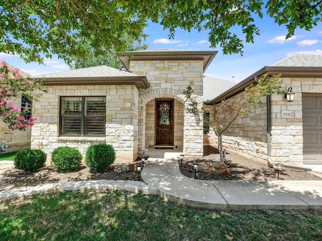 view of front of property featuring a garage