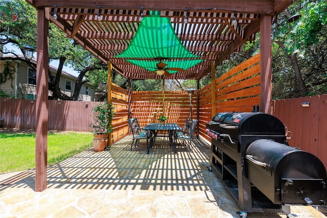 view of patio with a fenced backyard, a pergola, and outdoor dining space