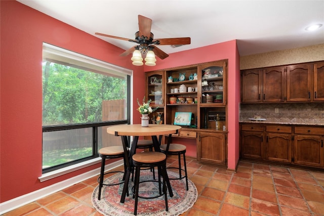 dining area featuring plenty of natural light and ceiling fan