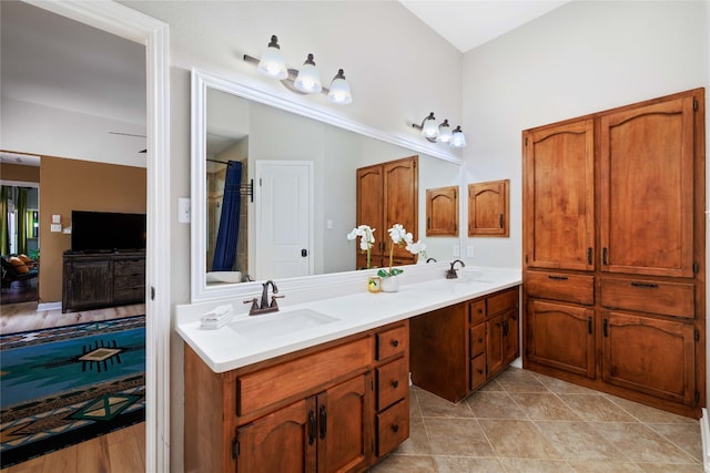 full bath with double vanity and a sink