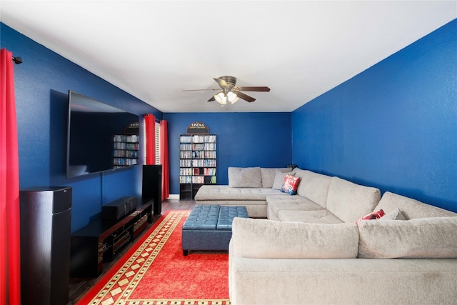 living room featuring ceiling fan and wood finished floors