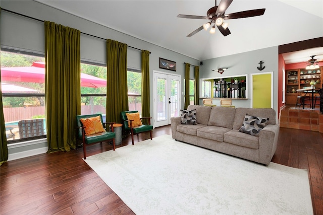 living room with vaulted ceiling, ceiling fan, french doors, and dark wood-style flooring