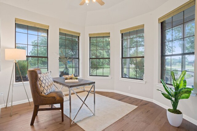 sunroom featuring ceiling fan