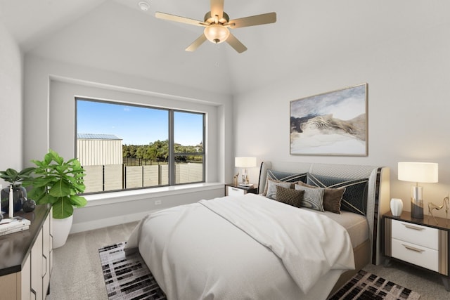 carpeted bedroom with ceiling fan and lofted ceiling