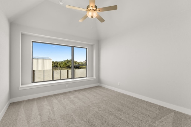 empty room with carpet floors, ceiling fan, and lofted ceiling