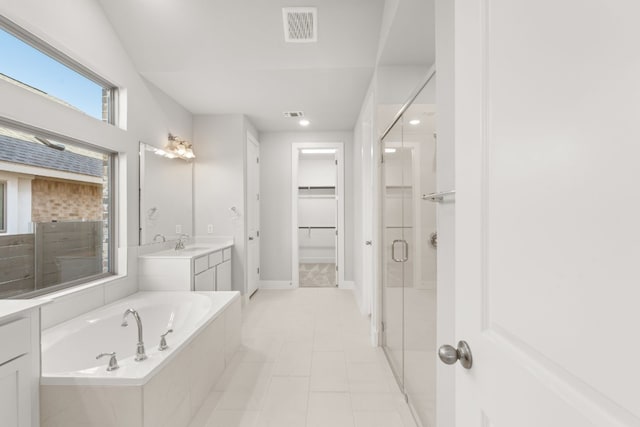 bathroom featuring tile patterned flooring, vanity, and independent shower and bath