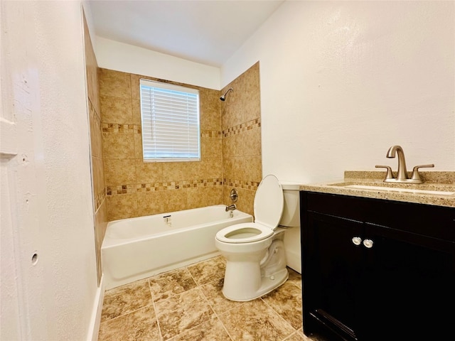 full bathroom featuring tile floors, vanity, toilet, and tiled shower / bath combo