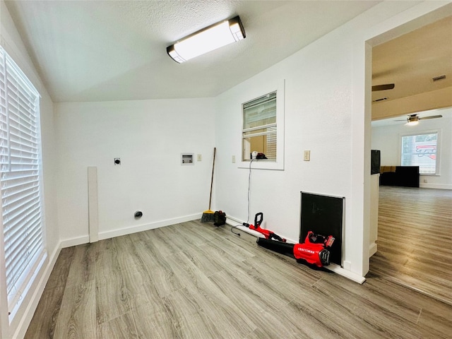 laundry area featuring electric dryer hookup, hardwood / wood-style floors, ceiling fan, and hookup for a washing machine