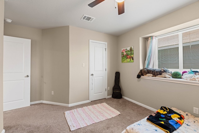 bedroom with ceiling fan and light colored carpet