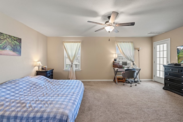 bedroom featuring carpet floors, ceiling fan, and multiple windows