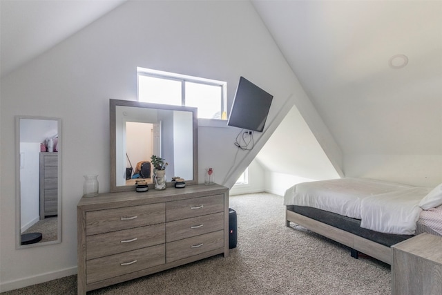 carpeted bedroom featuring lofted ceiling