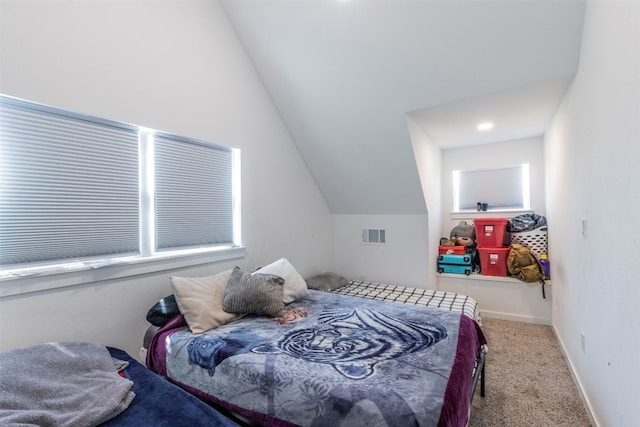 bedroom featuring carpet flooring and vaulted ceiling