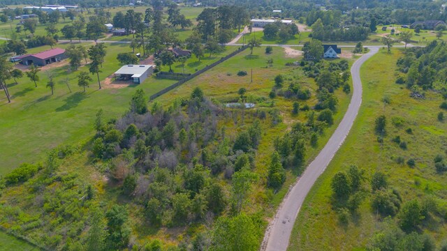 birds eye view of property featuring a rural view