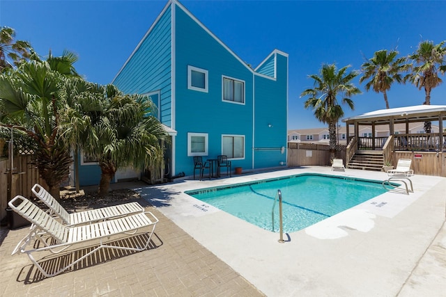 view of pool with a patio area and a gazebo