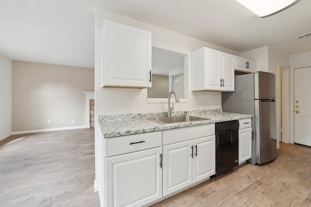 kitchen with stainless steel fridge, light wood-type flooring, white cabinets, sink, and dishwasher