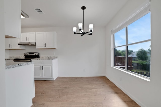 kitchen with pendant lighting, electric range, white cabinetry, and a notable chandelier