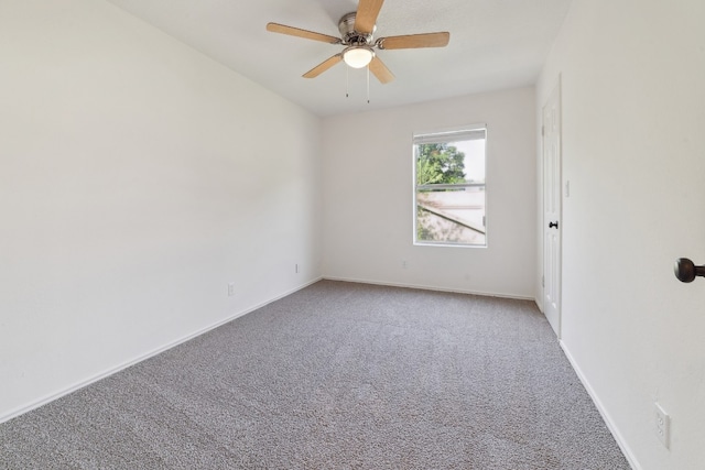 unfurnished room featuring ceiling fan and carpet floors