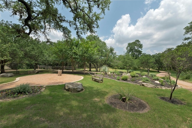 view of home's community featuring a yard