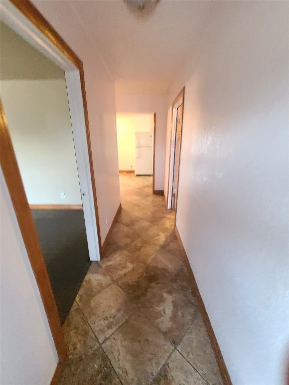 hallway with tile floors