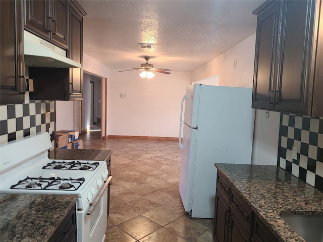 kitchen with a textured ceiling, white appliances, tile floors, tasteful backsplash, and ceiling fan