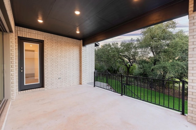 view of patio terrace at dusk