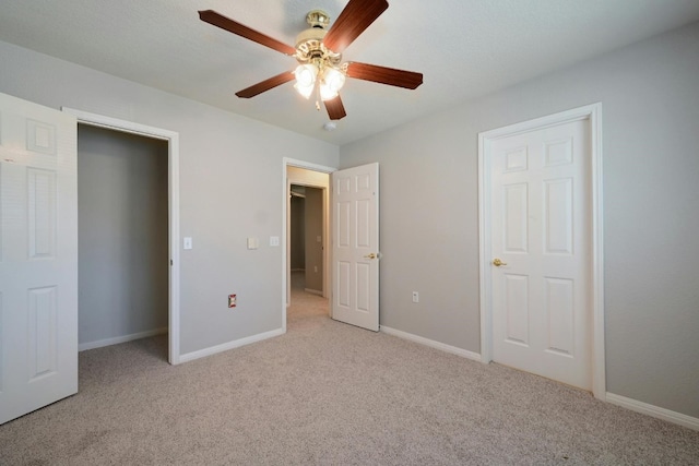 unfurnished bedroom with light colored carpet and ceiling fan