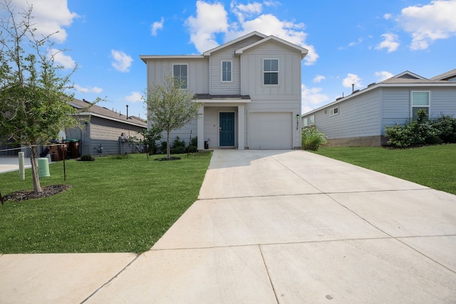 view of property with a front yard and a garage