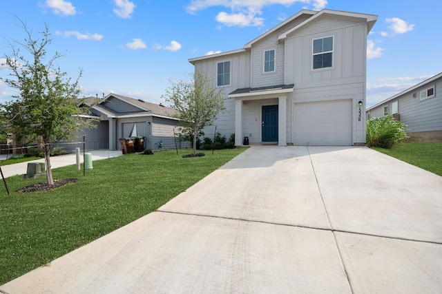 view of front of home featuring a garage and a front yard