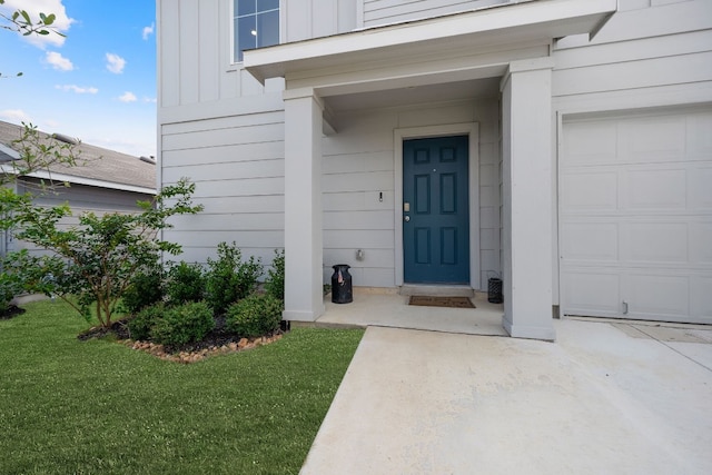 view of exterior entry featuring a garage