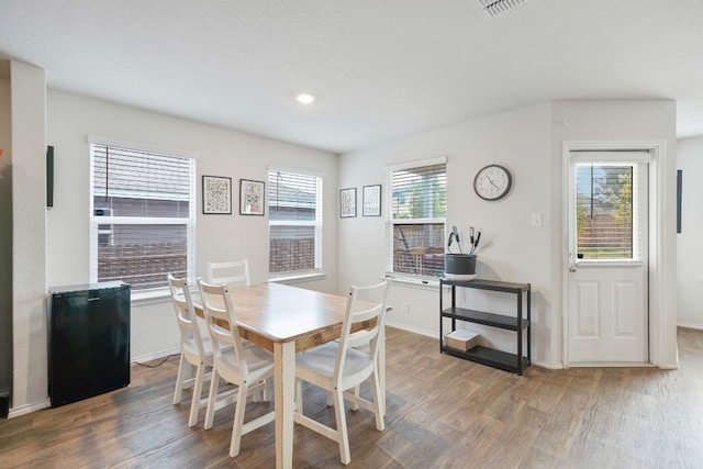 dining space featuring wood-type flooring