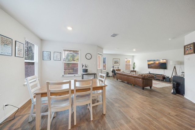 dining area featuring hardwood / wood-style floors