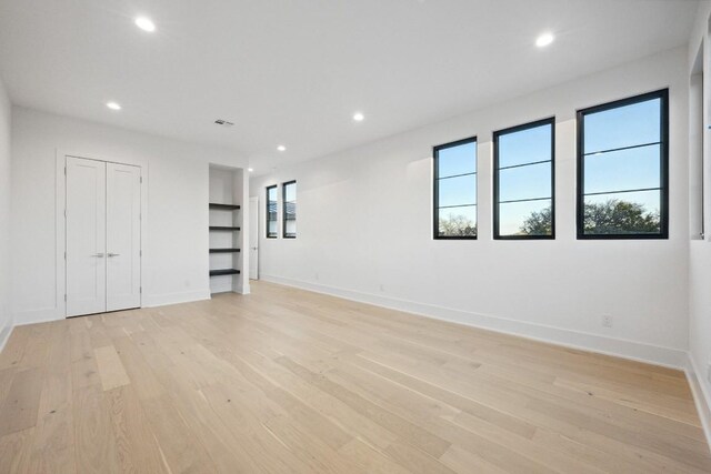 spare room featuring light hardwood / wood-style flooring