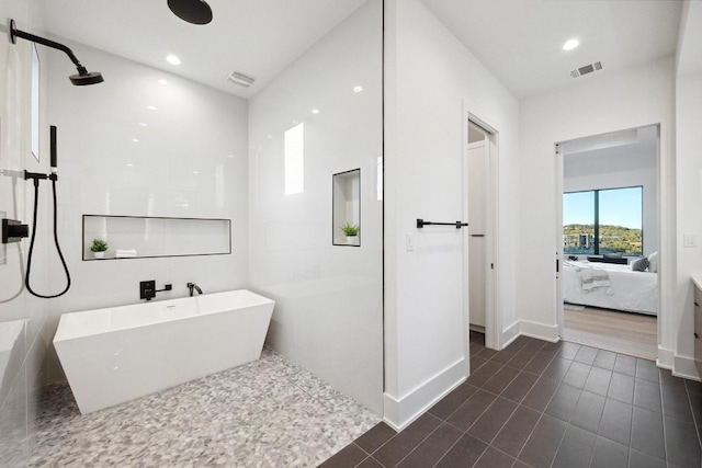 bathroom with shower with separate bathtub