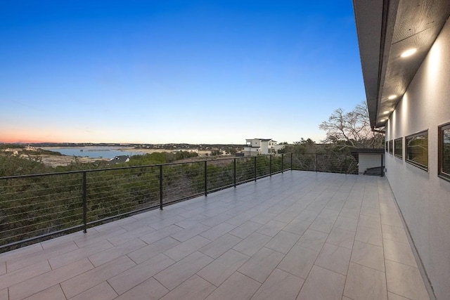 patio terrace at dusk with a water view